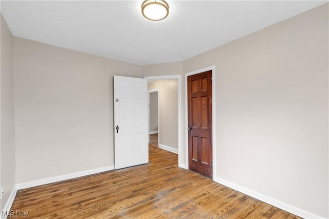 3781 Washington Blvd, University Heights, OH 44118 - unfurnished room featuring baseboards and wood finished floors