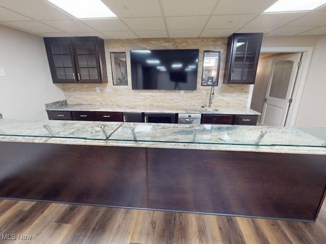 2474 Ginger Wren Rd, Pepper Pike, OH 44124 - bar featuring a drop ceiling, tasteful backsplash, and wood finished floors