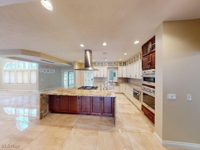 2474 Ginger Wren Rd, Pepper Pike, OH 44124 - kitchen with island range hood, glass insert cabinets, appliances with stainless steel finishes, a spacious island, and tasteful backsplash