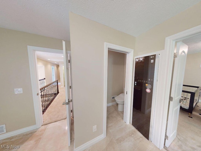 2474 Ginger Wren Rd, Pepper Pike, OH 44124 - hall featuring a textured ceiling and baseboards