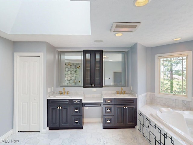 2474 Ginger Wren Rd, Pepper Pike, OH 44124 - full bathroom with double vanity and a garden tub