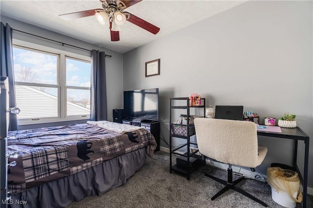 1582 Hilda Ave, Lakemore, OH 44250 - carpeted bedroom with a textured ceiling, a desk, and a ceiling fan