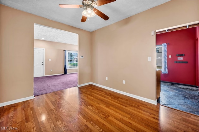 3303 Tuxedo Ave, Parma, OH 44134 - spare room with a ceiling fan and wood finished floors