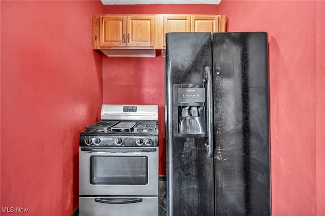 3303 Tuxedo Ave, Parma, OH 44134 - kitchen featuring black fridge with ice dispenser, stainless steel gas stove, and a textured ceiling