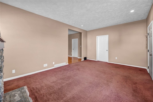 3303 Tuxedo Ave, Parma, OH 44134 - unfurnished living room with a textured ceiling, carpet flooring, recessed lighting, and a fireplace