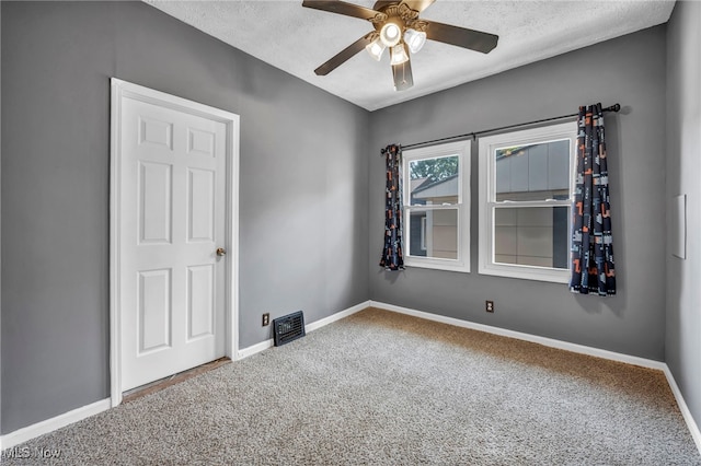 3303 Tuxedo Ave, Parma, OH 44134 - spare room with carpet, a ceiling fan, and a textured ceiling