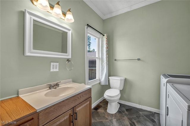 3303 Tuxedo Ave, Parma, OH 44134 - bathroom featuring washing machine and dryer, vanity, and crown molding