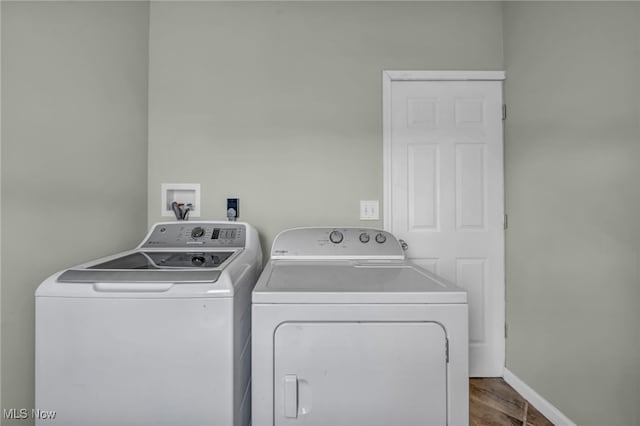 3303 Tuxedo Ave, Parma, OH 44134 - washroom with separate washer and dryer and wood finished floors