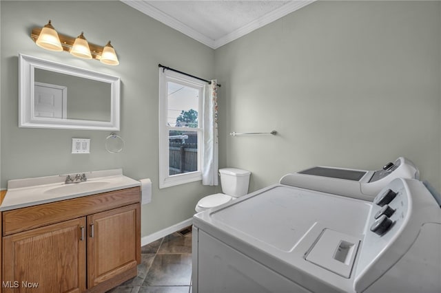 3303 Tuxedo Ave, Parma, OH 44134 - washroom with ornamental molding and washing machine and dryer