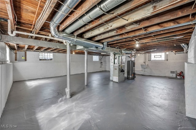 3303 Tuxedo Ave, Parma, OH 44134 - basement with gas water heater, heating unit, and electric panel