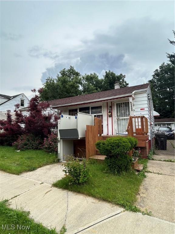 9822 Way Ave, Cleveland, OH 44105 - view of front of home with driveway and a chimney