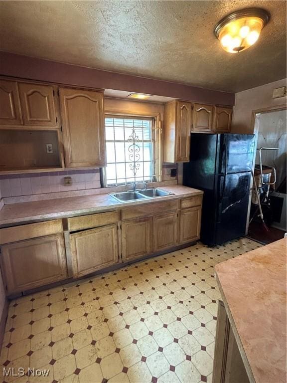 9822 Way Ave, Cleveland, OH 44105 - kitchen featuring freestanding refrigerator, light flooring, light countertops, a textured ceiling, and open shelves