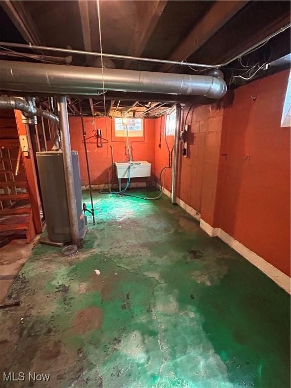 9822 Way Ave, Cleveland, OH 44105 - basement with water heater and a sink