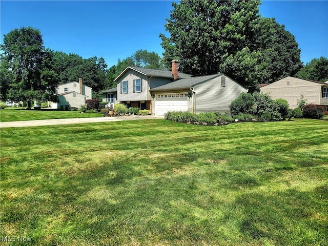 2977 Pirates Cv, Aurora, OH 44202 - view of front facade with a garage, a front lawn, concrete driveway, and brick siding