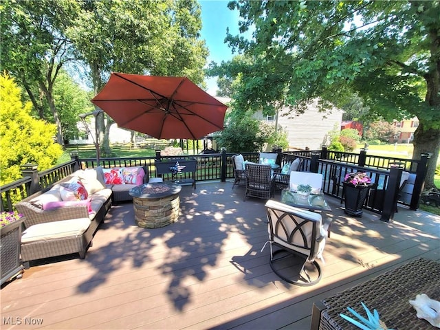2977 Pirates Cv, Aurora, OH 44202 - wooden deck featuring an outdoor living space with a fire pit and outdoor dining area