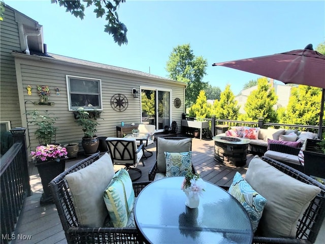 2977 Pirates Cv, Aurora, OH 44202 - wooden terrace with an outdoor living space with a fire pit and outdoor dining area