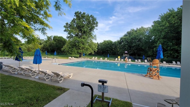 2977 Pirates Cv, Aurora, OH 44202 - community pool featuring a patio area and view of scattered trees