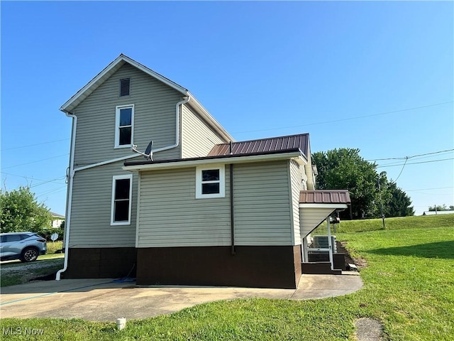 16707 Terrace Ave, Caldwell, OH 43724 - view of property exterior with a yard and a metal roof