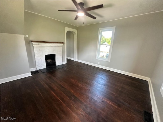 16707 Terrace Ave, Caldwell, OH 43724 - unfurnished living room with a fireplace, wood finished floors, ceiling fan, and arched walkways