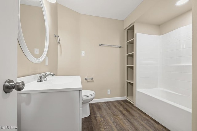 6434 Union Ave NE, Alliance, OH 44601 - bathroom featuring wood finished floors, vanity, and shower / washtub combination