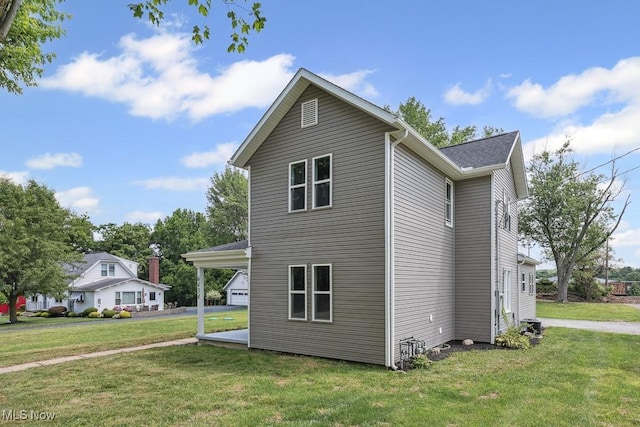 6434 Union Ave NE, Alliance, OH 44601 - view of side of property featuring a yard and an attached carport