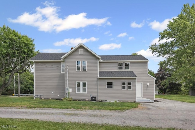 6434 Union Ave NE, Alliance, OH 44601 - rear view of house with a yard and a shingled roof