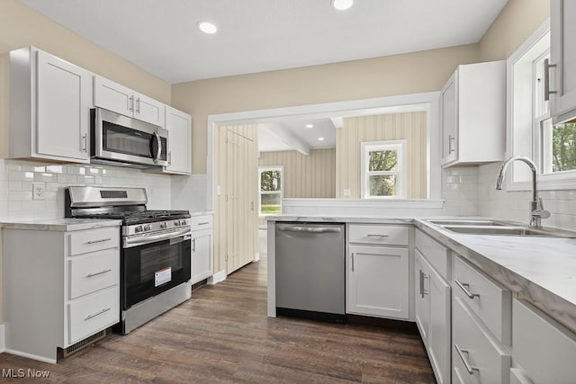 6434 Union Ave NE, Alliance, OH 44601 - kitchen with appliances with stainless steel finishes, plenty of natural light, light countertops, white cabinetry, and recessed lighting