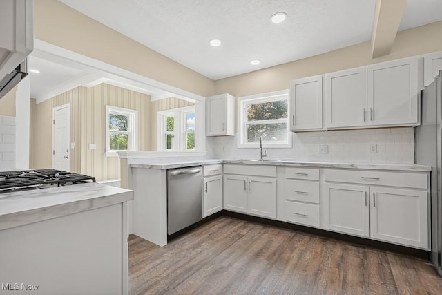 6434 Union Ave NE, Alliance, OH 44601 - kitchen with dishwasher, tasteful backsplash, light countertops, healthy amount of natural light, and beam ceiling