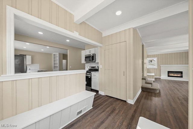 6434 Union Ave NE, Alliance, OH 44601 - kitchen featuring stainless steel appliances, dark wood finished floors, a glass covered fireplace, light countertops, and crown molding