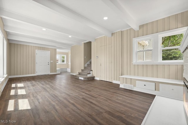 6434 Union Ave NE, Alliance, OH 44601 - unfurnished living room with wood finished floors, beamed ceiling, and stairs
