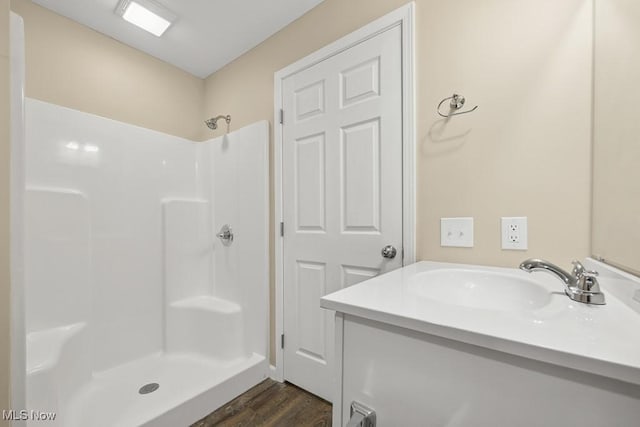 6434 Union Ave NE, Alliance, OH 44601 - full bath with wood finished floors, a shower, and vanity