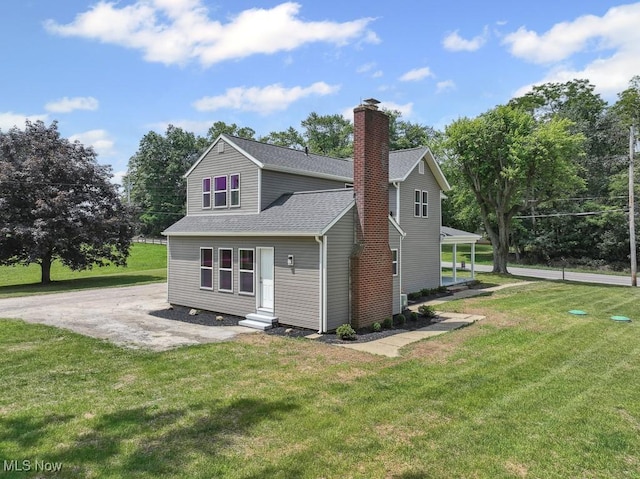 6434 Union Ave NE, Alliance, OH 44601 - view of front of property featuring entry steps, a chimney, a front lawn, and roof with shingles