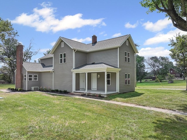 6434 Union Ave NE, Alliance, OH 44601 - traditional-style home featuring a porch, a chimney, and a front yard