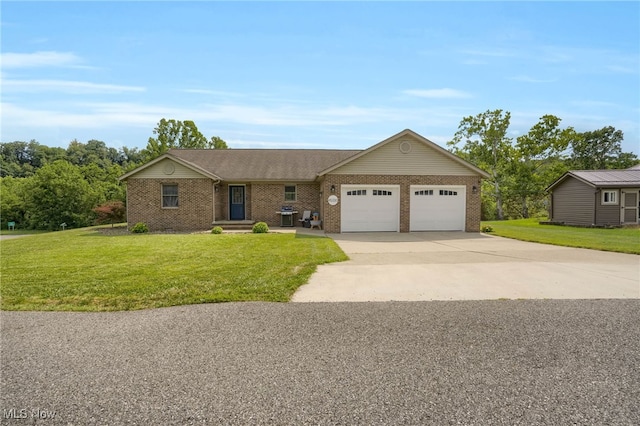 45330 Maple View Cir, Caldwell, OH 43724 - ranch-style home featuring an attached garage, brick siding, concrete driveway, and a front yard