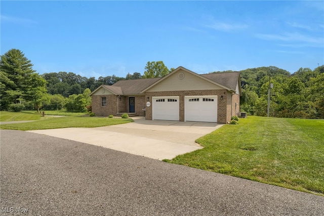 45330 Maple View Cir, Caldwell, OH 43724 - view of front of house featuring an attached garage, brick siding, a front yard, and concrete driveway