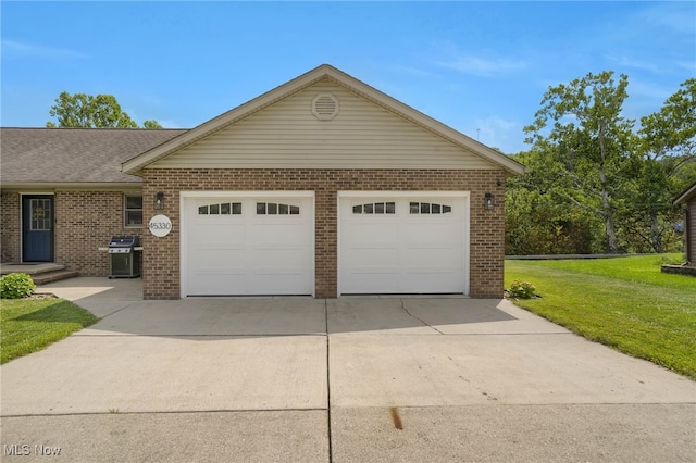 45330 Maple View Cir, Caldwell, OH 43724 - view of front of home featuring brick siding, driveway, a garage, and a front yard