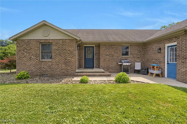 45330 Maple View Cir, Caldwell, OH 43724 - view of front of house featuring a front lawn, brick siding, a patio area, and a shingled roof
