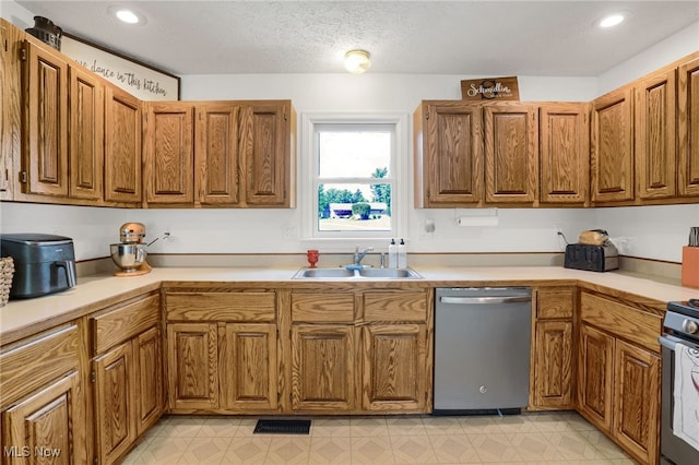 45330 Maple View Cir, Caldwell, OH 43724 - kitchen featuring dishwasher, light countertops, brown cabinets, range, and recessed lighting
