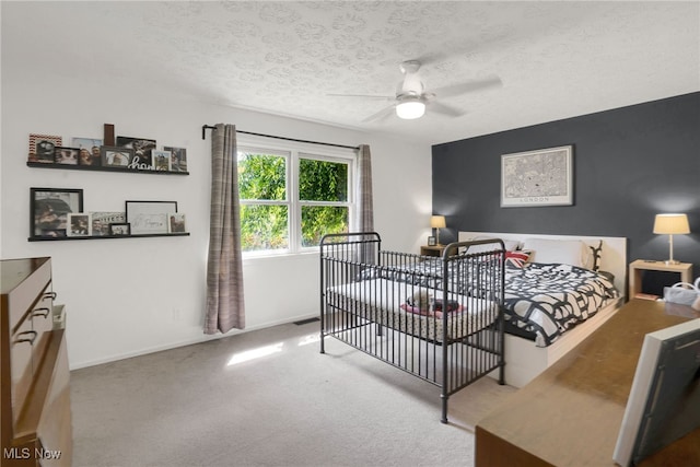 45330 Maple View Cir, Caldwell, OH 43724 - carpeted bedroom featuring a textured ceiling and a ceiling fan