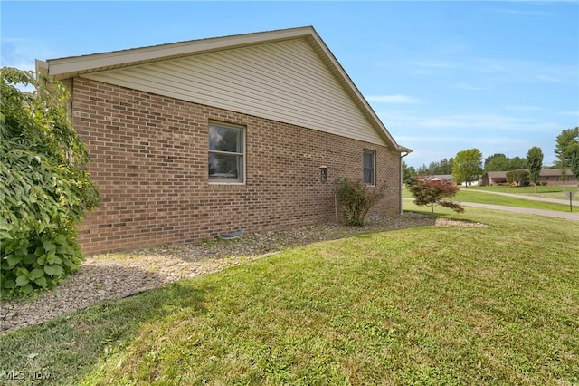 45330 Maple View Cir, Caldwell, OH 43724 - view of side of property featuring a lawn and brick siding