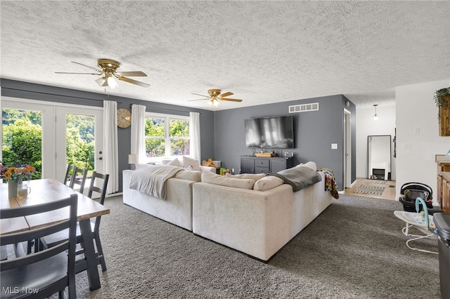 45330 Maple View Cir, Caldwell, OH 43724 - carpeted living room with ceiling fan and a textured ceiling