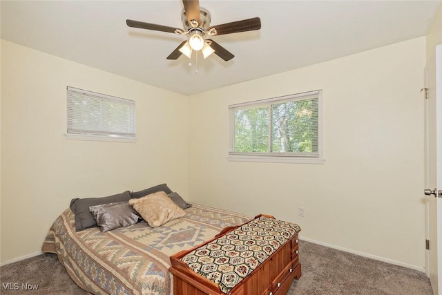 3498 Clayton Dr, North Olmsted, OH 44070 - bedroom with dark carpet and a ceiling fan