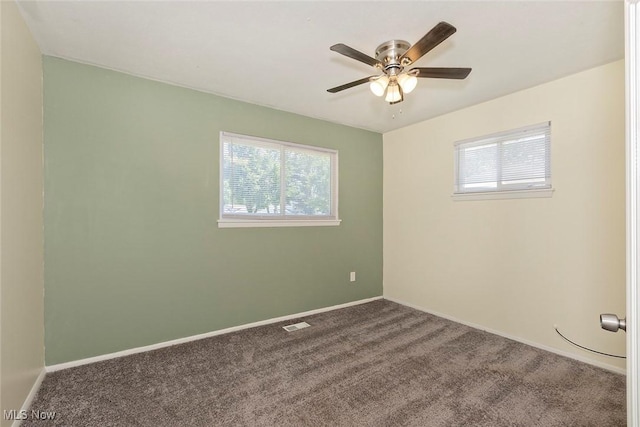 3498 Clayton Dr, North Olmsted, OH 44070 - carpeted spare room with plenty of natural light and a ceiling fan