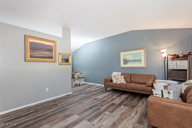 3498 Clayton Dr, North Olmsted, OH 44070 - living room featuring vaulted ceiling and dark wood-style floors