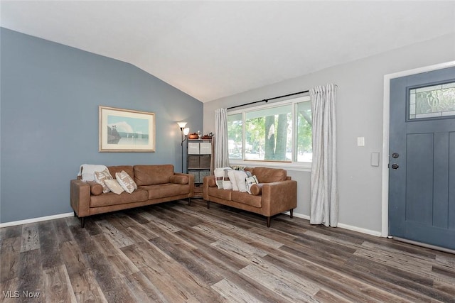3498 Clayton Dr, North Olmsted, OH 44070 - living room with vaulted ceiling, dark wood-type flooring, and plenty of natural light
