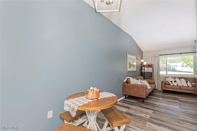3498 Clayton Dr, North Olmsted, OH 44070 - dining area featuring lofted ceiling and wood finished floors