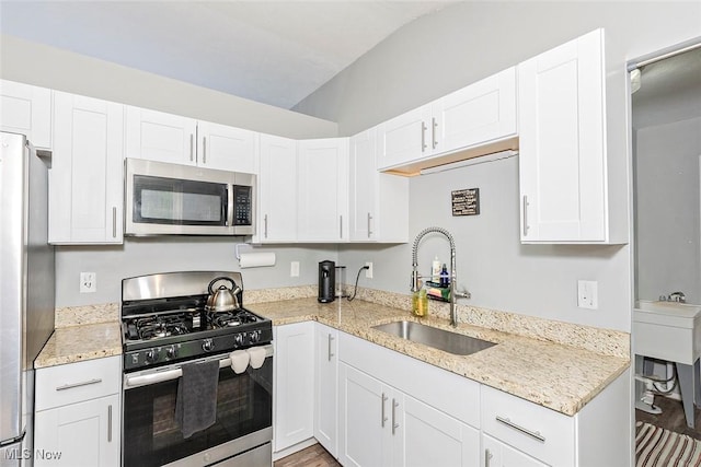 3498 Clayton Dr, North Olmsted, OH 44070 - kitchen with appliances with stainless steel finishes, white cabinetry, and light stone countertops
