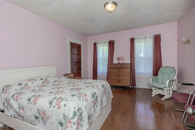1744 Northfield Ave, East Cleveland, OH 44112 - bedroom featuring a textured ceiling and dark wood-style flooring