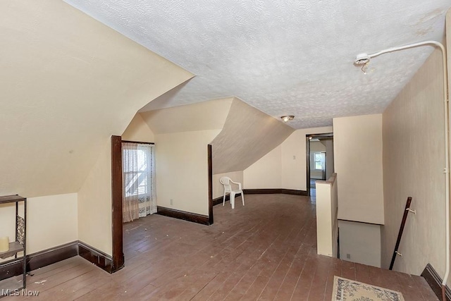 1744 Northfield Ave, East Cleveland, OH 44112 - additional living space with hardwood / wood-style flooring, a textured ceiling, and lofted ceiling