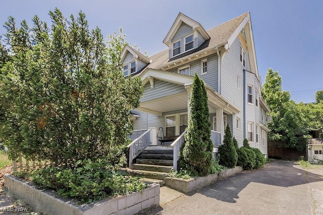 1744 Northfield Ave, East Cleveland, OH 44112 - view of front of home featuring covered porch and a shingled roof